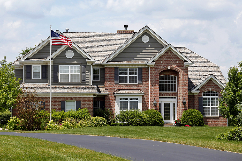 Luxury brick home seen while providing home inspection services