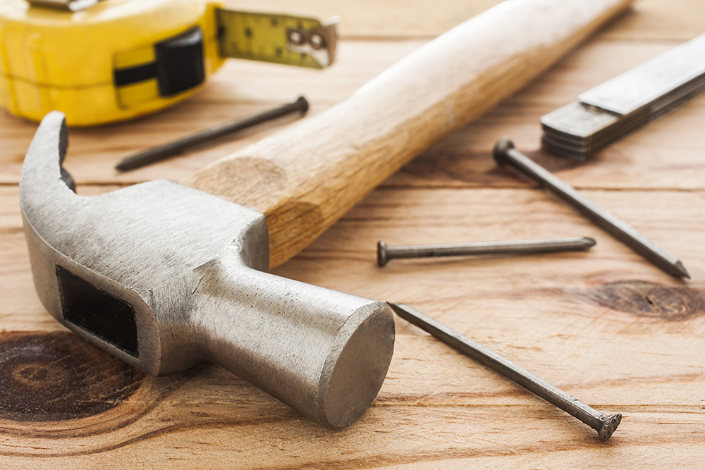 Maintenance tools laying out on a wood table before home inspection services are preformed