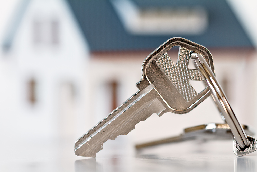 Buyer's new house keys after passing a thorough home inspection services